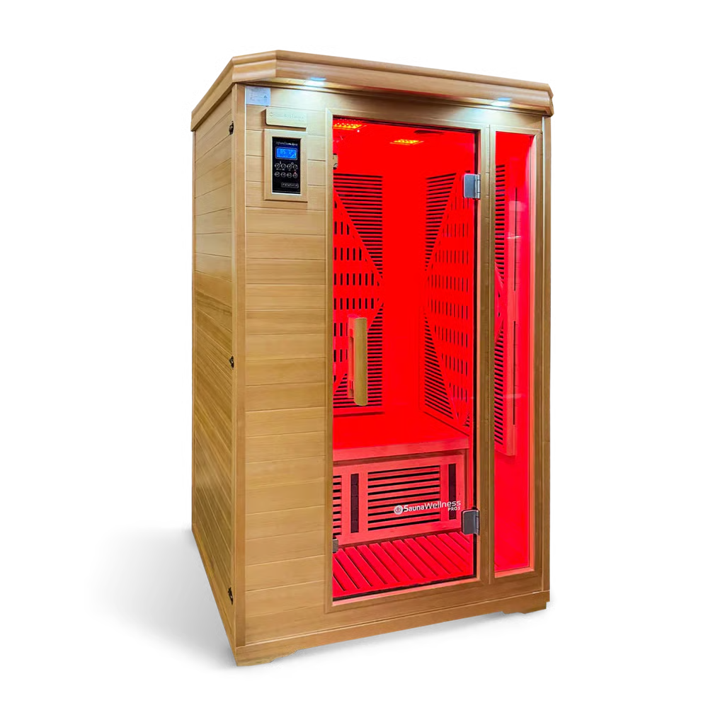 Sauna de infrarrojos de madera con luces interiores rojas y puerta de cristal.